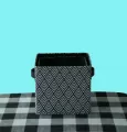 Set of two rectangular gray plate storage baskets with rounded corners, printed geometric pattern, leather handle